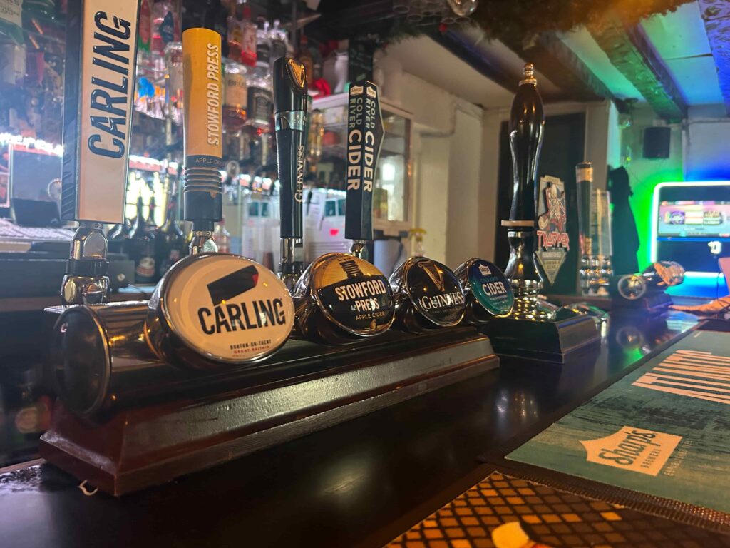 different draft beers at coach and horses abergavenny, icnluding carling, stowford press and guiness